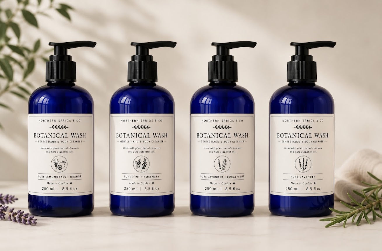 Collection of Northern Sprigs & Co. Botanical Washes in amber bottles featuring Pure Lavender, Pure Lavender + Eucalyptus, Pure Lemongrass + Orange, and Pure Mint + Rosemary scents.